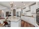 A spacious kitchen with a marble island, stainless appliances, and custom cabinetry at 3006 Portico Pl # 37, Fort Mill, SC 29715