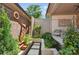 Serene backyard walkway with stepping stones, lush greenery, and unique metal art at 3006 Portico Pl # 37, Fort Mill, SC 29715