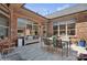 Spacious outdoor patio featuring a dining area and lounge seating with large windows to the home's interior at 3006 Portico Pl # 37, Fort Mill, SC 29715