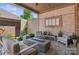 Relaxing covered patio with a contemporary fire pit and plush seating, ideal for outdoor living at 3006 Portico Pl # 37, Fort Mill, SC 29715