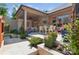 Multi-level patio with dining and lounge areas surrounded by lush landscaping and colorful flowers at 3006 Portico Pl # 37, Fort Mill, SC 29715