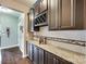 Entertaining space with granite countertops and dark wood cabinetry at 308 Hollister Estates Dr, Waxhaw, NC 28173