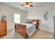 Bedroom with window, carpeted floors, TV, and wooden furniture at 308 Hollister Estates Dr, Waxhaw, NC 28173