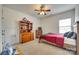 Cozy bedroom with a ceiling fan, dresser, and a door that leads to a closet at 308 Hollister Estates Dr, Waxhaw, NC 28173