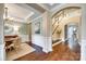Grand foyer showcases hardwood floors, staircase, and arched doorways at 308 Hollister Estates Dr, Waxhaw, NC 28173