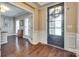 Elegant entryway with gleaming hardwood floors and attractive millwork at 308 Hollister Estates Dr, Waxhaw, NC 28173