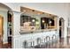 Stylish kitchen with dark cabinetry, granite counters, and seating at the bar at 308 Hollister Estates Dr, Waxhaw, NC 28173