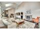Open-concept living room with vaulted ceilings, stone fireplace, and hardwood floors at 308 Hollister Estates Dr, Waxhaw, NC 28173
