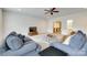 Spacious living room featuring carpeted floors, comfortable seating, and TV at 308 Hollister Estates Dr, Waxhaw, NC 28173
