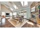 Open-concept living area with vaulted ceilings, fireplace, and lots of natural light at 308 Hollister Estates Dr, Waxhaw, NC 28173
