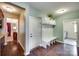 Mudroom with storage bench, cabinets, and access to laundry room at 308 Hollister Estates Dr, Waxhaw, NC 28173