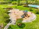 Community playground with slides, swings, and benches surrounded by green spaces at 308 Hollister Estates Dr, Waxhaw, NC 28173