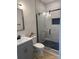 Bathroom boasts a glass shower door and decorative tile flooring at 3114 Ansonville Rd, Marshville, NC 28103