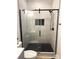 Modern bathroom features a glass enclosed shower and decorative tile floor at 3114 Ansonville Rd, Marshville, NC 28103