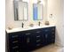 Bathroom features double sinks, dark vanity and attractive hardware at 3114 Ansonville Rd, Marshville, NC 28103