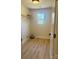 Spacious walk-in closet with wood-look floors, wire shelving, and natural light at 3114 Ansonville Rd, Marshville, NC 28103