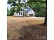 Charming two-story home with board and batten siding and a brown, two-car attached garage at 3114 Ansonville Rd, Marshville, NC 28103