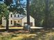 Charming two-story modern farmhouse with white siding, dark accents, and attached two car garage at 3114 Ansonville Rd, Marshville, NC 28103