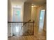 Upstairs hallway with natural light and hardwood flooring at 3114 Ansonville Rd, Marshville, NC 28103