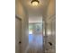 Hallway leading to living area with natural light and views of the deck at 3114 Ansonville Rd, Marshville, NC 28103