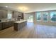Modern kitchen with a large island, stainless steel appliances, and ample cabinet space at 3114 Ansonville Rd, Marshville, NC 28103