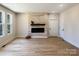 Bright living room showcases an electric fireplace, stylish flooring, and natural lighting at 3114 Ansonville Rd, Marshville, NC 28103