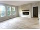 Open floor plan with an electric fireplace, large windows and neutral paint at 3114 Ansonville Rd, Marshville, NC 28103