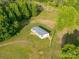 Aerial view of a charming home with a light roof, spacious yard and surrounded by lush greenery at 317 Berry Trl, Wadesboro, NC 28170