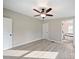 Spacious bedroom featuring hardwood floors, ceiling fan, ensuite bathroom and natural light at 317 Berry Trl, Wadesboro, NC 28170