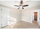 Bedroom featuring a modern ceiling fan, light-colored walls, and access to a connecting bathroom at 317 Berry Trl, Wadesboro, NC 28170