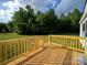 Wooden deck with railings offering a great view of the surrounding greenery at 317 Berry Trl, Wadesboro, NC 28170