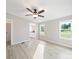 Cozy living room offering hardwood floors and a ceiling fan and views of the outside from the window at 317 Berry Trl, Wadesboro, NC 28170