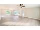 A sun-filled living room boasts neutral tones, vinyl flooring and an open layout at 317 Berry Trl, Wadesboro, NC 28170