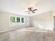 Inviting living room with large windows providing natural light and neutral walls and hardwood floors at 317 Berry Trl, Wadesboro, NC 28170