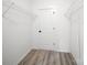A spacious walk-in closet with wire shelving and vinyl flooring presents lots of storage options at 317 Berry Trl, Wadesboro, NC 28170