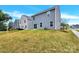 Backyard view of a two-story house with a lawn at 3212 Coast Oak Rd, Charlotte, NC 28214