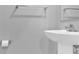Close-up of a pedestal sink and fixtures in a modern bathroom at 3212 Coast Oak Rd, Charlotte, NC 28214