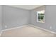 Bright bedroom with neutral carpet and a large window at 3212 Coast Oak Rd, Charlotte, NC 28214