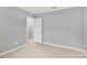Carpeted bedroom with neutral walls and a view into the hallway at 3212 Coast Oak Rd, Charlotte, NC 28214