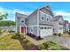Two-story home with gray siding, white trim, bright red front door, and an attached white two-car garage at 3212 Coast Oak Rd, Charlotte, NC 28214