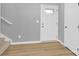 Inviting foyer with wood-look flooring and white entry door at 3212 Coast Oak Rd, Charlotte, NC 28214