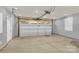 Spacious garage with a large door and high ceilings at 3212 Coast Oak Rd, Charlotte, NC 28214
