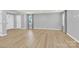 Bright living room with neutral walls, wood flooring, and natural light from windows at 3212 Coast Oak Rd, Charlotte, NC 28214