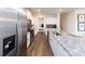 Stylish kitchen with stainless steel appliances, granite countertops, and wood floors at 4210 Steel Way, Sherrills Ford, NC 28673