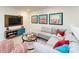 Open living room area with modern furniture and movie-themed decorations at 4210 Steel Way, Sherrills Ford, NC 28673