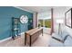 Stylish home office with blue walls, a large window, and ample workspace for productivity at 4210 Steel Way, Sherrills Ford, NC 28673