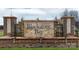An inviting entrance to Blackstone Bay with a stone and brick sign featuring small decorative waterfalls at 4212 Steel Way, Sherrills Ford, NC 28673