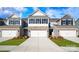 Charming townhome with two-car garage, stone accents, and neatly manicured lawn at 4216 Steel Way, Sherrills Ford, NC 28673