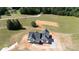 Aerial view of a new construction home on a spacious lot featuring a black roof and concrete driveway at 4648 Simpson Rd, Edgemoor, SC 29712