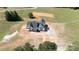 Aerial view of new construction home featuring a sleek black roof, a white exterior and a concrete driveway at 4648 Simpson Rd, Edgemoor, SC 29712